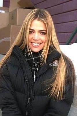 Denise Richards in black The North Face “Nuptse” down jacket